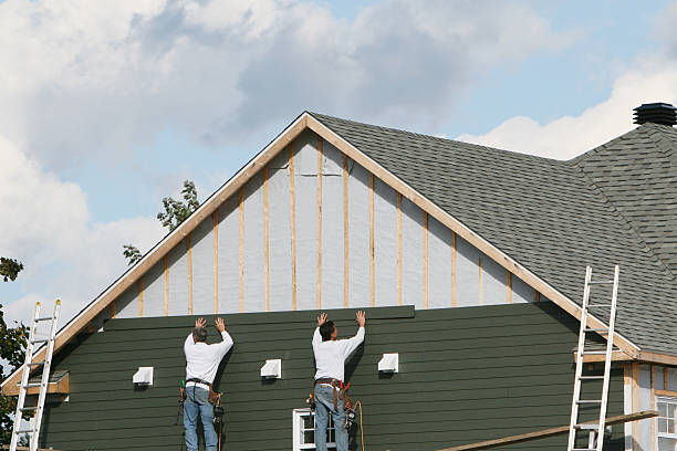 Professional Storm Damage Siding Repair technician working in Chagrin Falls, OH